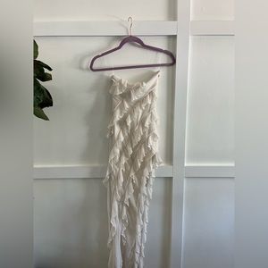 Strapless white ruffle dress with slit on the side. Never worn. Too small.